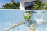 This is a lifestyle image showing a young girl swimming underwater wearing the lime green colored goggles.