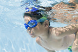 This is a lifestyle image showing a young boy swimming underwater wearing the blue colored goggles.