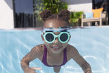 This is a lifestyle image showing a young girl swimming underwater wearing the neon blue colored goggles.