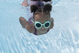 This is a lifestyle image showing a young girl swimming underwater wearing the neon blue goggles.