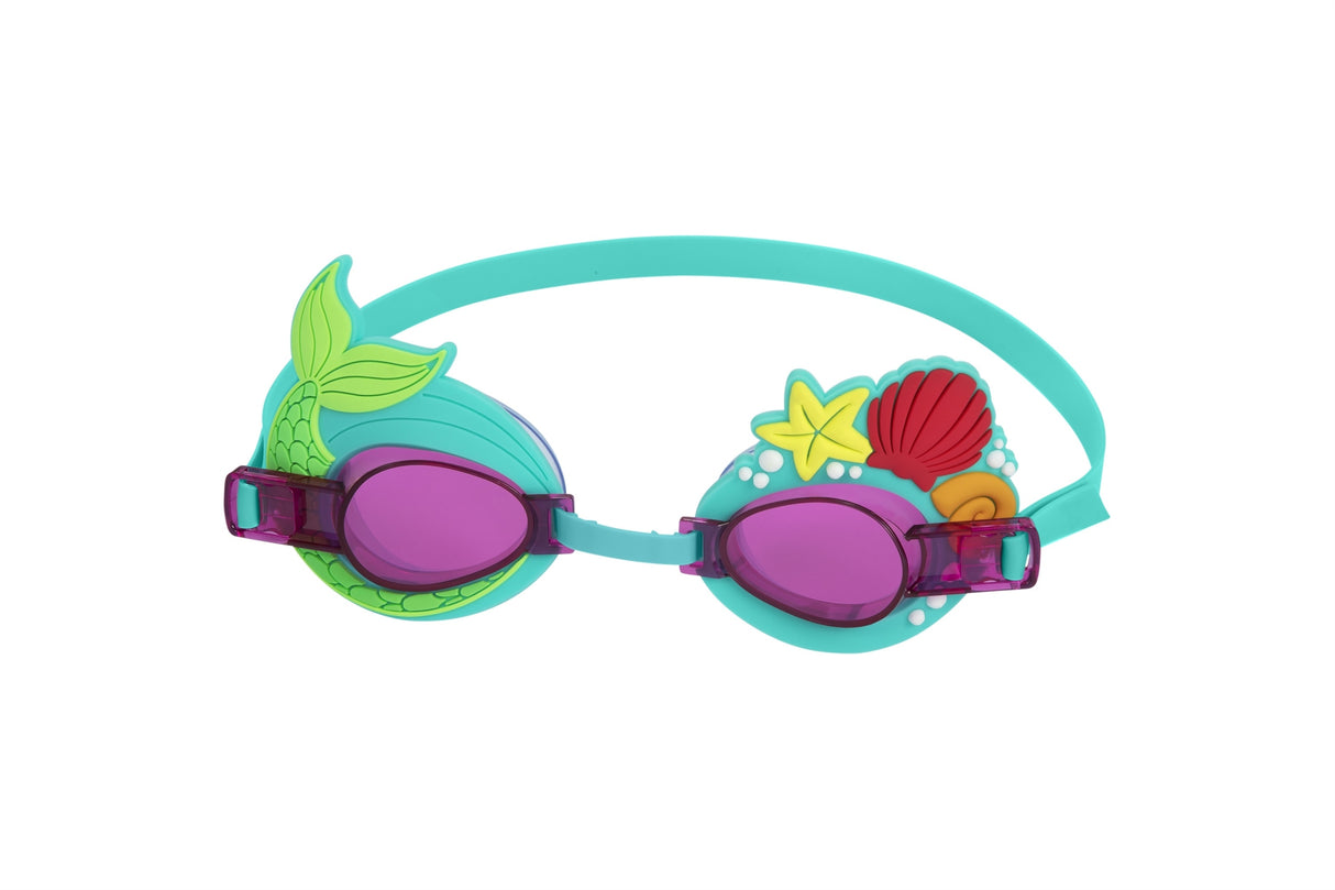 This image shows the mermaid themed kids goggles on a white background. The lenses are purple and the strap is a teal color. On the left eyecup, there's a green colored mermaid tail. On the right eyecup, there's a yellow starfish, a red clam shell and an orange sundial shell surrounded by little white dots.