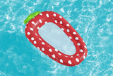 This is a lifestyle image showing the strawberry pool lounge floating atop the pool water.