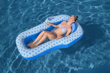 This is a lifestyle image showing a woman resting inside the float in the pool.