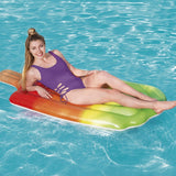 This is a lifestyle image showing a woman resting on the pool float in the pool.