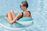 This is a lifestyle image showing a woman sitting in the pool chair inside a pool.