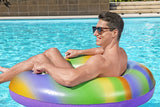 This is a lifestyle image showing a man sitting inside the inner tube and holding onto the handles on the sides.