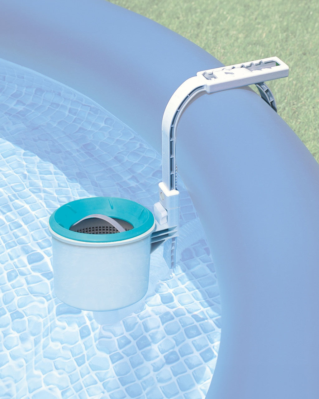 This is a lifestyle image showing the automatic surface skimmer mounted on the inflatable wall of an Intex pool.