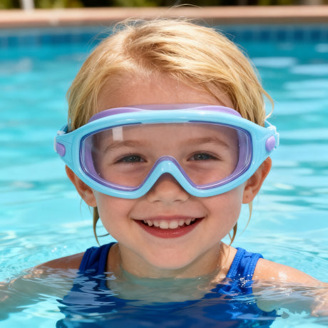 This is a lifestyle image showing a little kid wearing the purple and blue goggles in a pool.