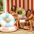 This is a lifestyle image showing two young adults sitting around the three different inner tube options.