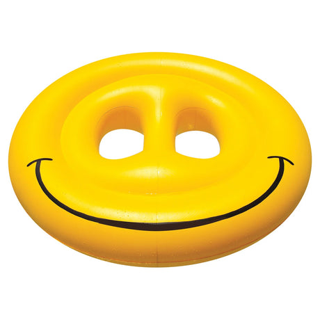 This image shows the smiley face pool float on a white background. The inflatable is round and yellow. The "eyes" are empty and the smile is large and black.