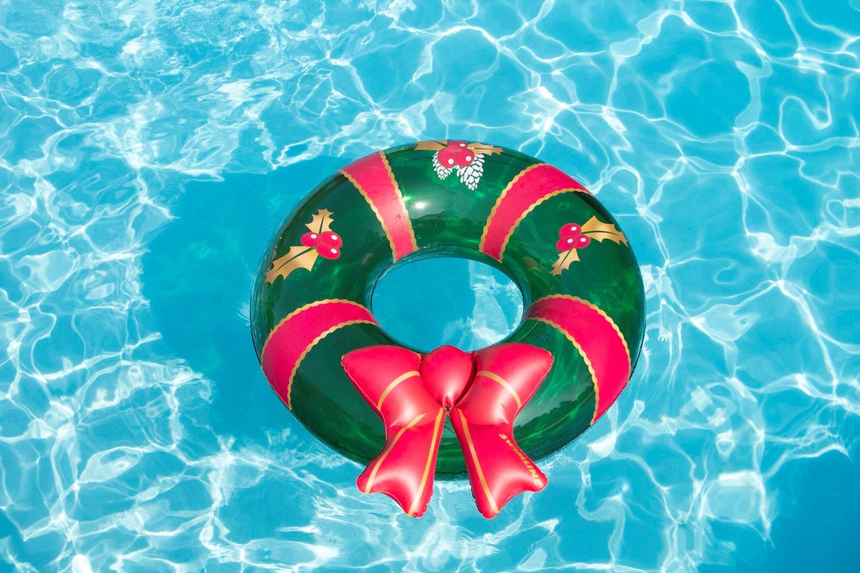 This image shows the wreath inner tube floating in a pool.