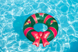 This image shows the wreath inner tube floating in a pool.