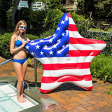 This is a lifestyle image showing a girl standing in a pool and holding the pool float.