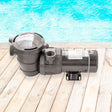 This is a lifestyle image showing the pump on a deck next to a pool.