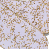 This is an up close view of the white ribbon and gold swirl leaf design.