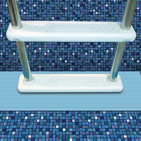 This is a lifestyle image showing a light blue pool mat underneath a pool ladder.