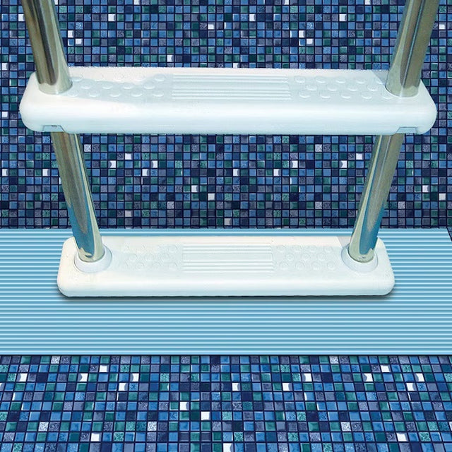 This is a lifestyle image showing a light blue pool mat underneath a pool ladder.