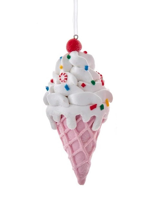 This ornament is designed to look like an ice cream cone with white ice cream on a pink cone. There's a cherry on top, multi-colored sprinkles and small peppermint candies.