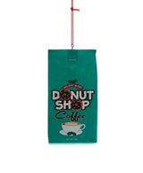 This ornament was designed to look like a bag of coffee that is green and reads "Holiday Blend Donut Shop Coffee."