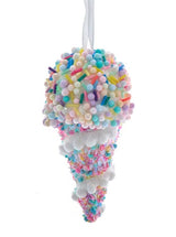 This ornament features multi-colored beads and sprinkles on top and on the base.