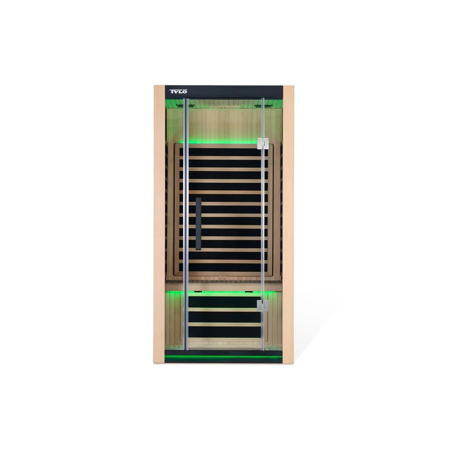 Light brown colored home sauna that fits 1 person. The lights inside the sauna can be changed. The lights in this image are green.