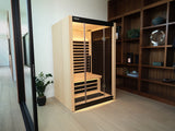A light brown, 1-person sauna inside someone's home.