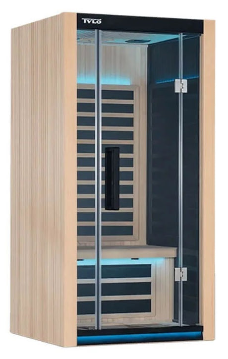 Light brown colored home sauna that fits 1 person. The lights inside the sauna can be changed. The lights in this image are blue.