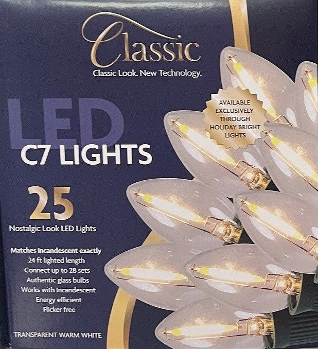 This image shows the box that these transparent warm white lights come in. It reads "Classic look, new technology. LED C7 lights. 25 nostalgic-look LED lights. Matches incandescent exactly. 24 ft. lighted length. Connect up to 28 sets. Authentic glass bulbs. Works with incandescent. Energy-efficient. Flicker free."