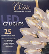 This image shows the box that these transparent warm white lights come in. It reads "Classic look, new technology. LED C7 lights. 25 nostalgic-look LED lights. Matches incandescent exactly. 24 ft. lighted length. Connect up to 28 sets. Authentic glass bulbs. Works with incandescent. Energy-efficient. Flicker free."