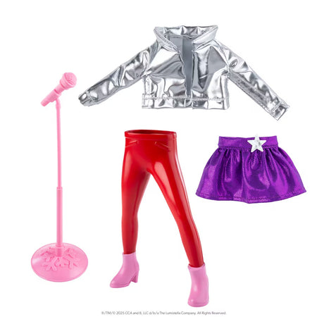 This image shows what comes in this elf kit: a pink microphone stand with microphone, a silver jacket, a shiny purple skirt with a silver heart on it and "magic" red pants with pink boots. The red pants are designed to make your Scout Elf stand upright without any help.