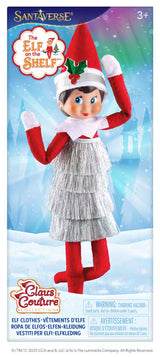 This image shows the packaging that this elf dress comes in. It reads "Santaverse. The Elf on the Shelf. Claus Couture Collection Elf Clothes. Ages 3+"