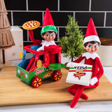 This is a lifestyle image showing a Scout Elf sitting in the pizza truck holding a pizza while another Scout Elf sits next to the truck holding the pizza box.
