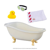 This image shows everything that comes in this kit on a white background. It includes: a yellow rubber ducky, a cucumber mask, a white towel with red stripes and a small elf-sized bathtub.