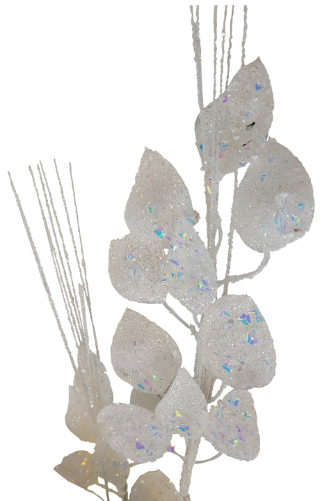 This image shows a white glitter pick spray with leaves and branches decorated with iridescent glitter. This image shows it on a white background.