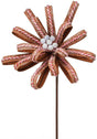 This image shows a decorative pick spray made of brown loops covered in white glitter. The loops feature red and white striped string and there are white glitter covered balls in the center.