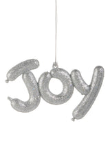 This ornament reads "JOY" and was designed to look like it was shaped from balloons. It's covered in silver glitter.
