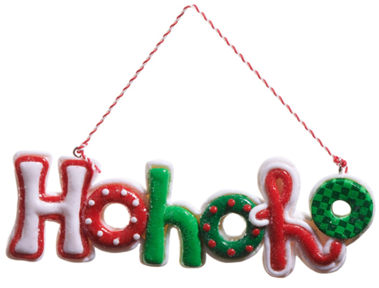 This image shows an ornament that reads "Ho ho ho." It's designed to look like it's made of cookies that have been decorated with different colored frosting. The first H is white with a red border. The first O is red with white polka dots. The second H is green. The second O is green with red polka dots. The third H is red with a white border. The third O is light green and dark green checkered.