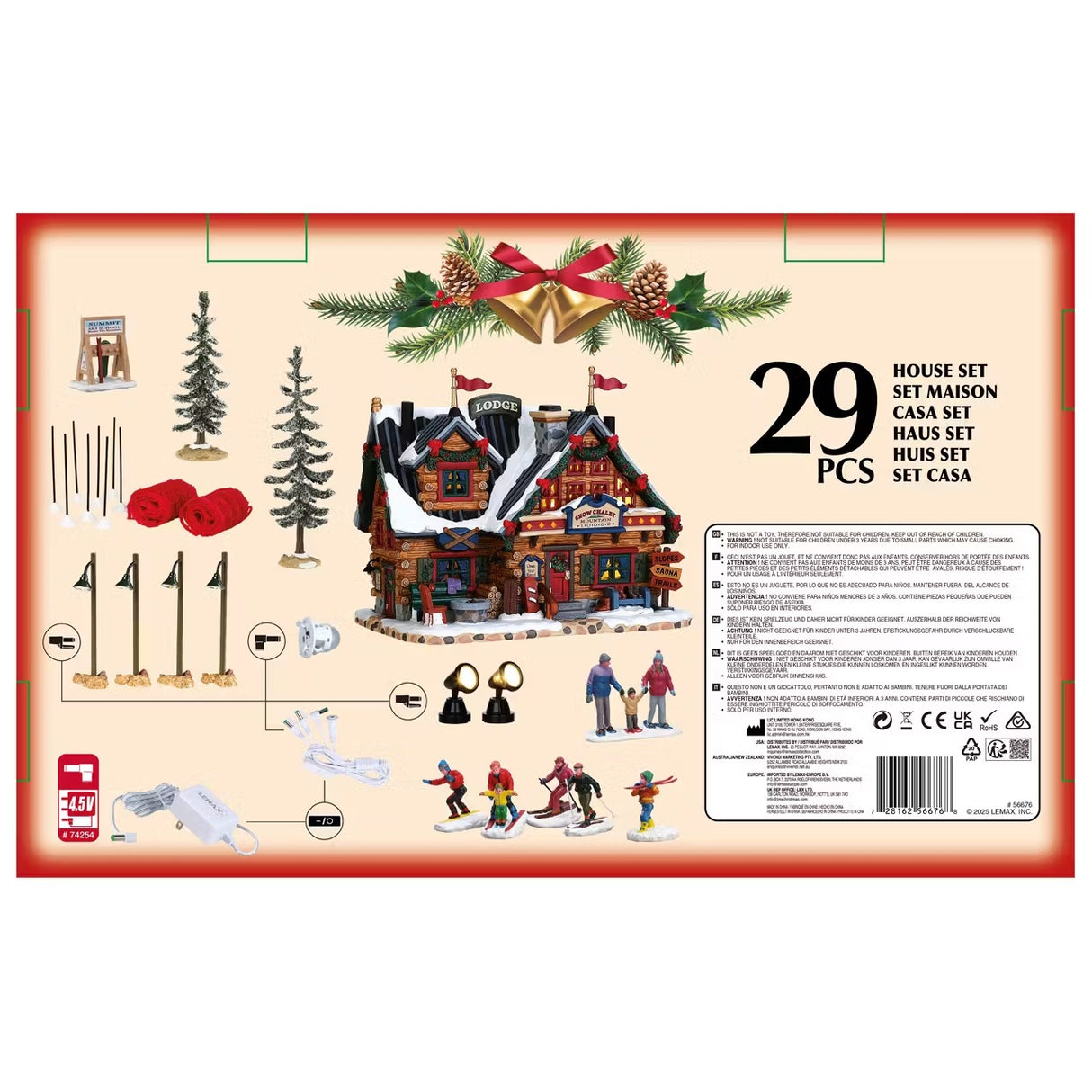 This is the back of the box showing all 29 items that are included. There's a village sign, two trees, eight poles for the two red fences, four lamp posts, a building, three lights, six figurines and two adaptors.
