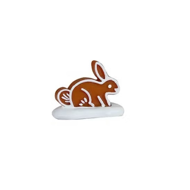 This figurine is shaped like a bunny standing on all four legs.