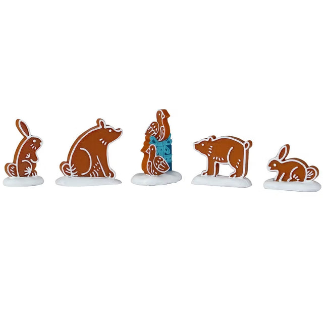 This is a set of 5 Lemax figurines that are designed to look like gingerbread cookies shaped like different animals. They all have white "frosting" like details.