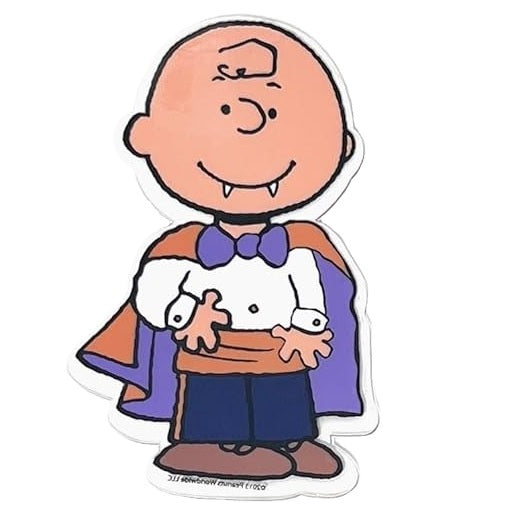 This image shows one of the gel clings. It's designed to look like Charlie Brown smiling with two cute vampire teeth. He's wearing an orange and purple cape, a white long sleeve shirt, an orange cummerbund, blue pants and brown shoes. 