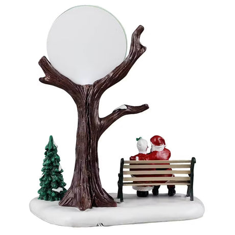 This is the back of the accent. You can see the tree, and the tree and the back of Santa and Mrs. Claus's heads.