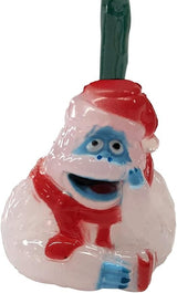This is an up close view of one of the Bumble lights. Bumble is wearing a red Santa hat and a red scarf. He has blue skin near his eyes, mouth and on his hands. The rest of him is white.
