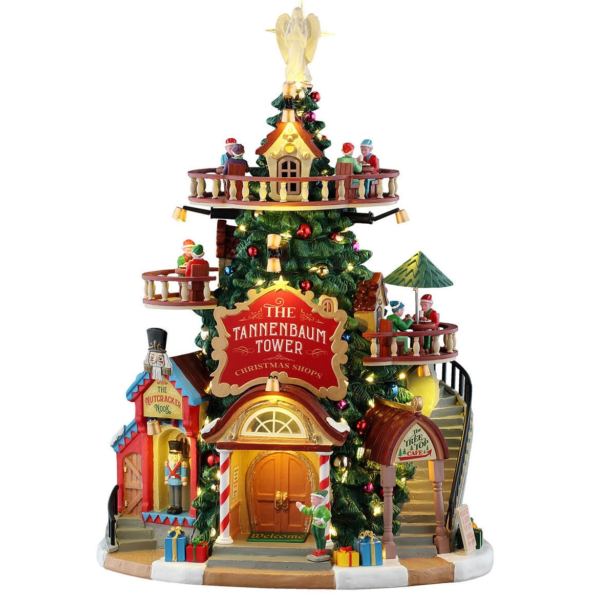 This is a Lemax lighted building designed to look like stores built into a very tall Christmas tree. There's an angel on the top, a balcony wrapped around the tip of the tree, there are two balconies on the sides, along with a staircase. There are shiny ornaments on the tree. At the bottom there's an elf welcoming you.
