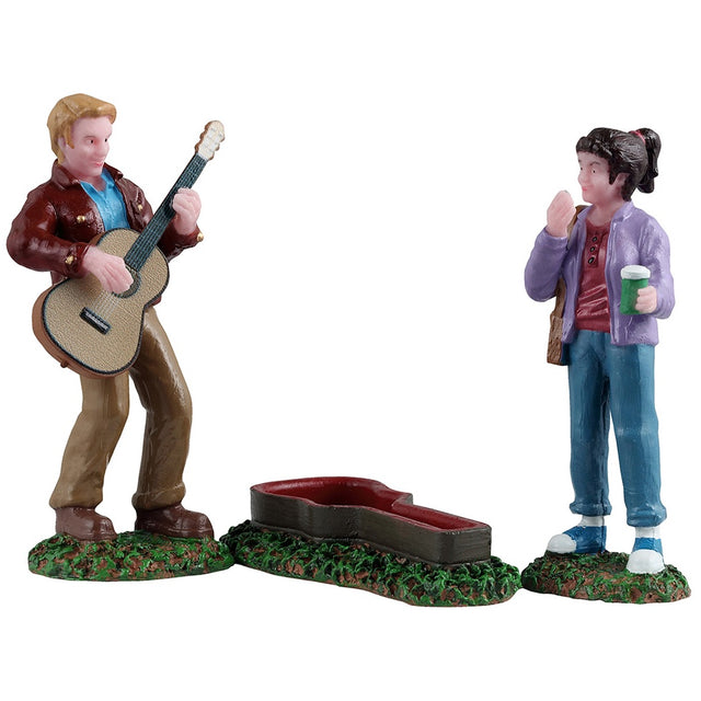 This is a set of three Lemax figurines designed to look like a man playing guitar next to an open guitar case as a girl watches in awe.