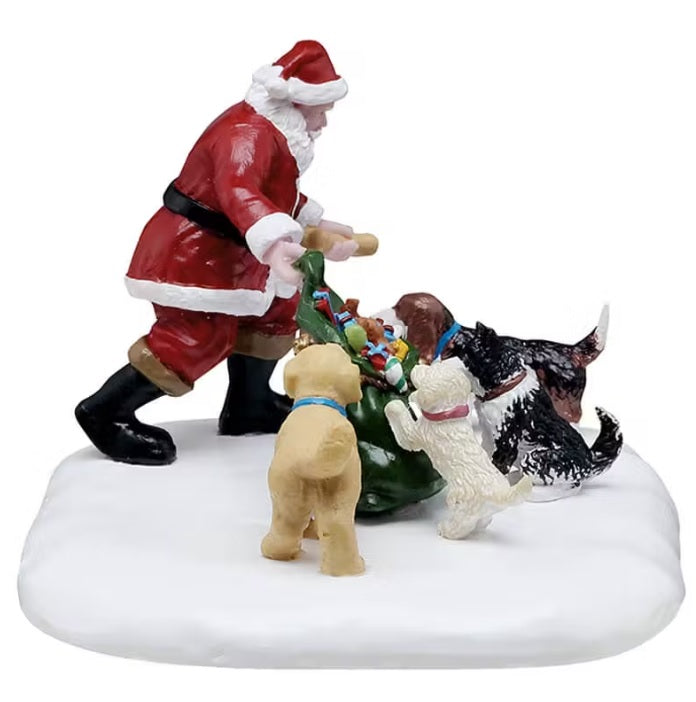 This is a different view of Santa giving things to dogs out of his green bag.