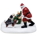 This is a different view of Santa giving treats to dogs.
