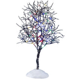 This is a Lemax lighted tree. It's pre-lit with multi-colored lights. The branches are skinny and bare and designed to look like there's snow on them. This is showing it on a white background.
