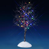 This is a Lemax lighted tree. It's pre-lit with multi-colored lights. The branches are skinny and bare and designed to look like there's snow on them. This is showing it on a blue background.