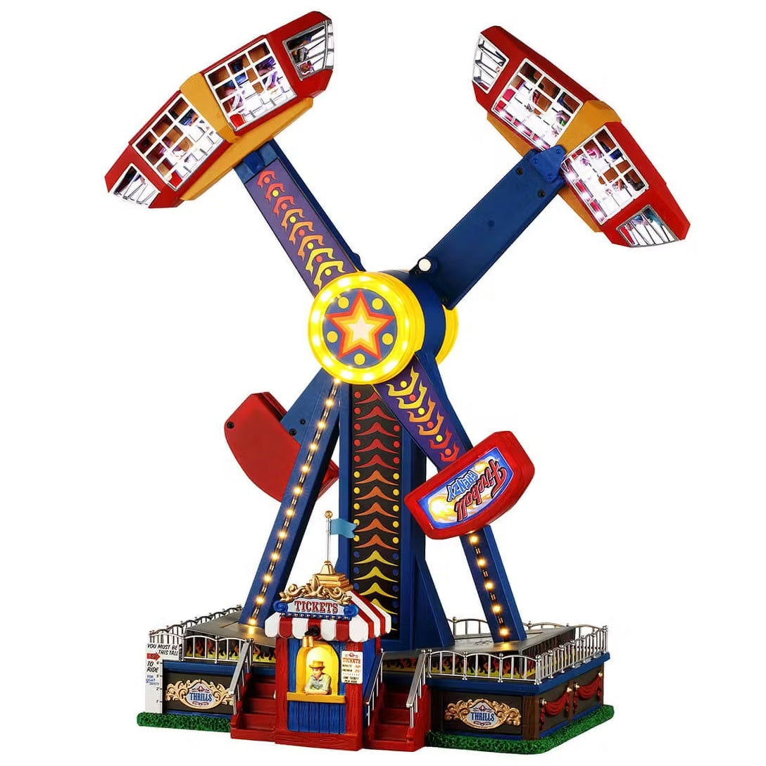 This is a Lemax piece designed to look like a carnival ride. The two arms on the ride spin around fast, making the people inside go upside down. The ride is brightly colored.